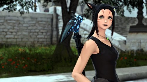 My main FFXIV Character, here with a mining pick equipped, glancing seriously at something off-camera. 